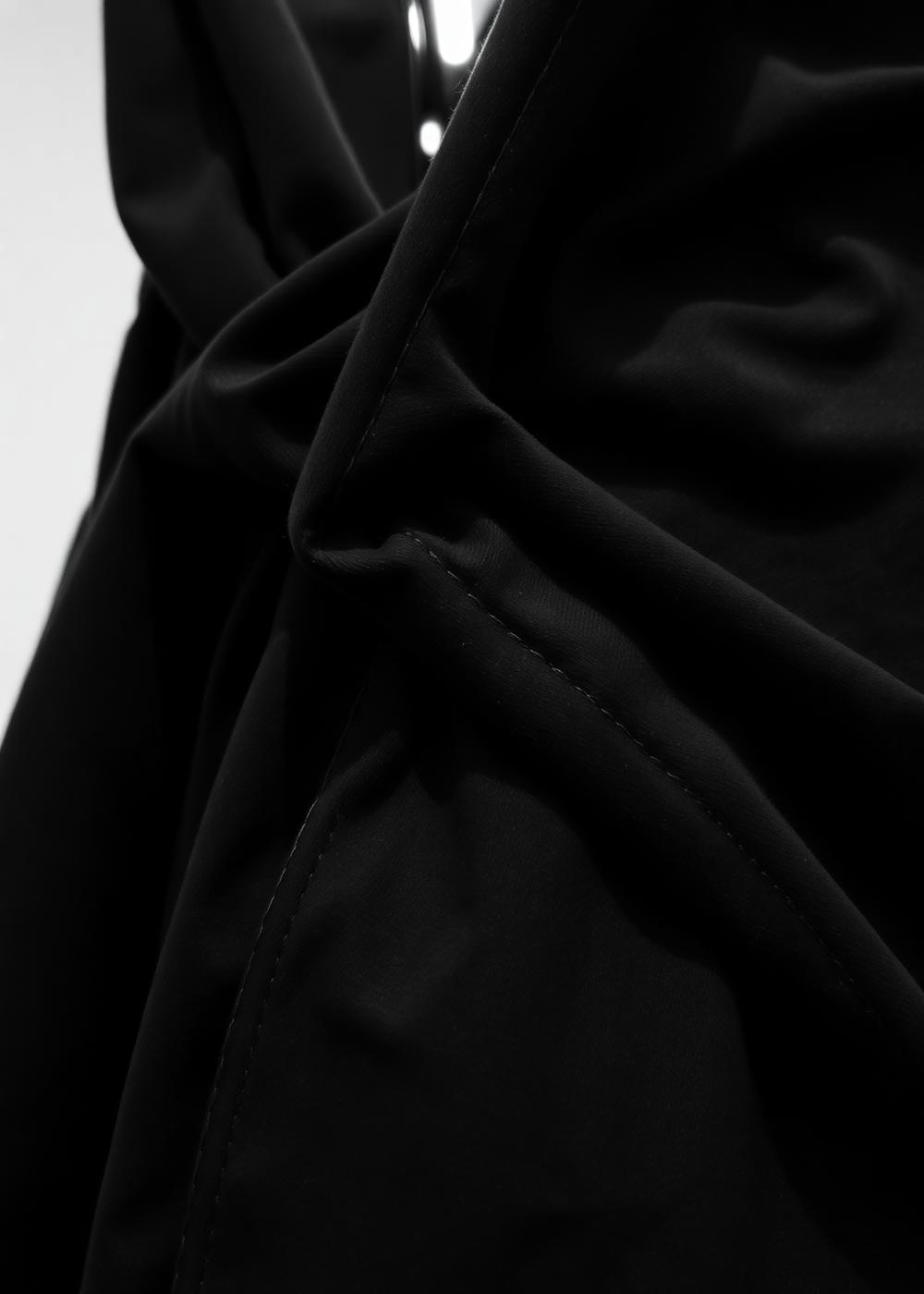 Close-up of a garment's raw stitching.